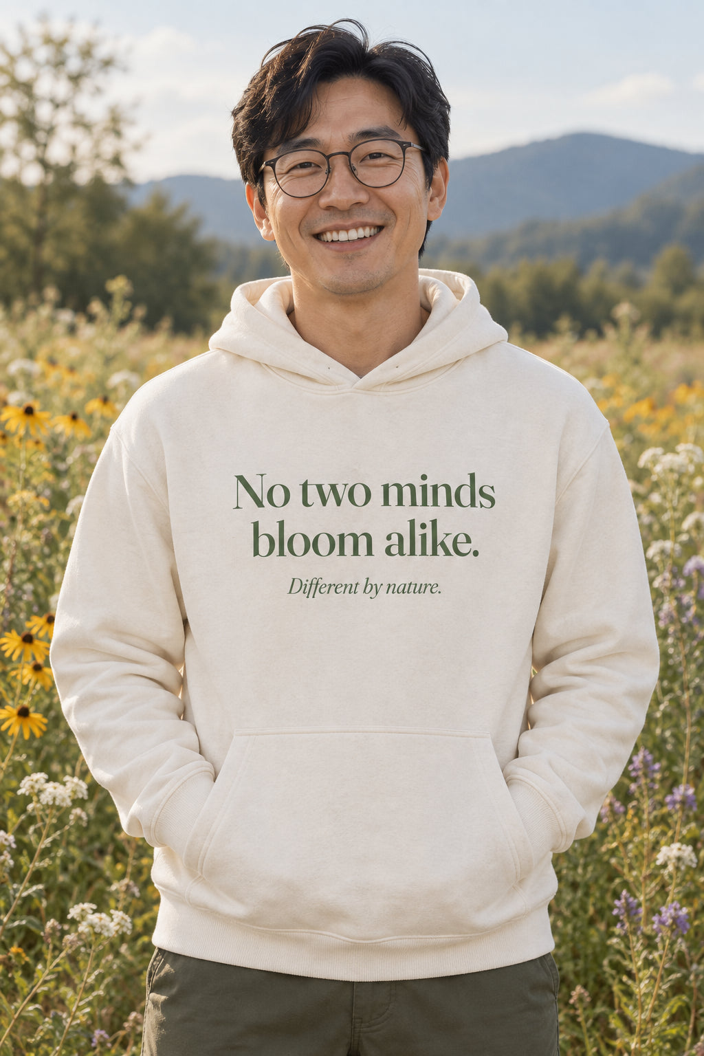 No two minds bloom alike. unisex organic cotton hoodie in Natural, front