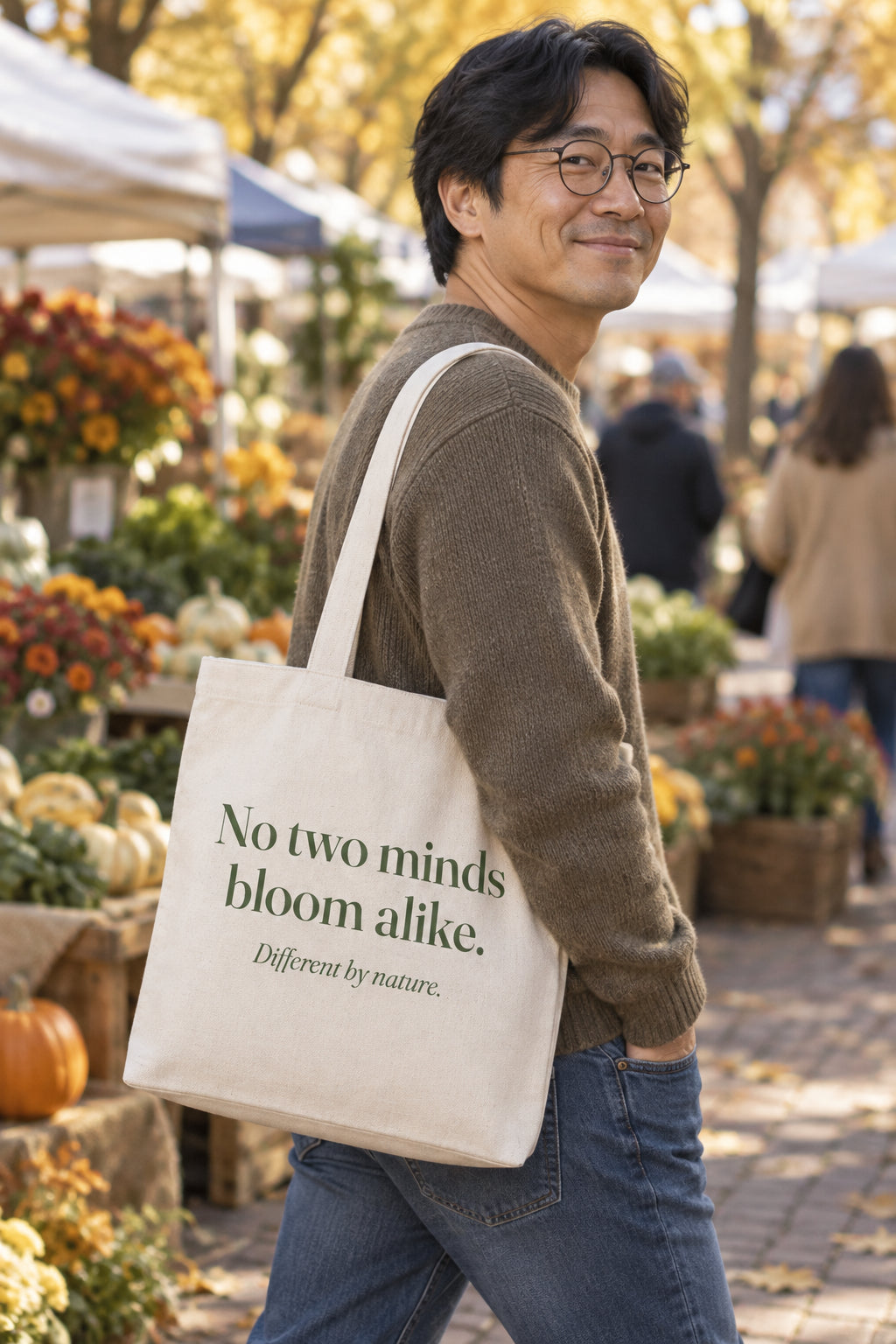 No two minds bloom alike. organic canvas market tote in Natural, carried on the shoulder