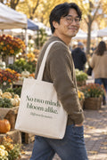 No two minds bloom alike. organic canvas market tote in Natural, carried on the shoulder