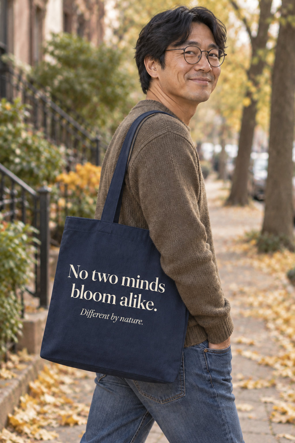No two minds bloom alike. organic canvas market tote in Navy, carried on the shoulder