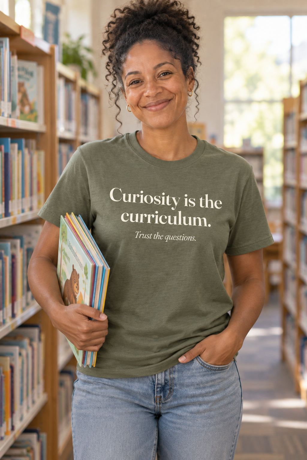 Curiosity is the curriculum. unisex organic cotton tee in Moss, front
