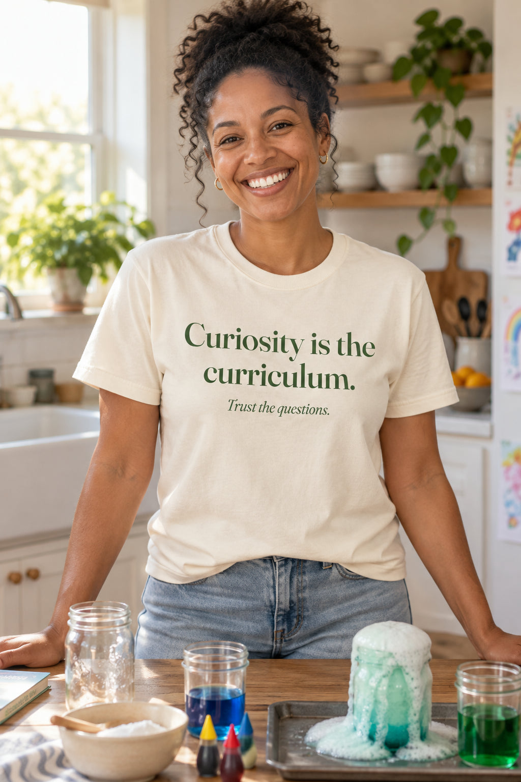 Curiosity is the curriculum. unisex organic cotton tee in Natural, front