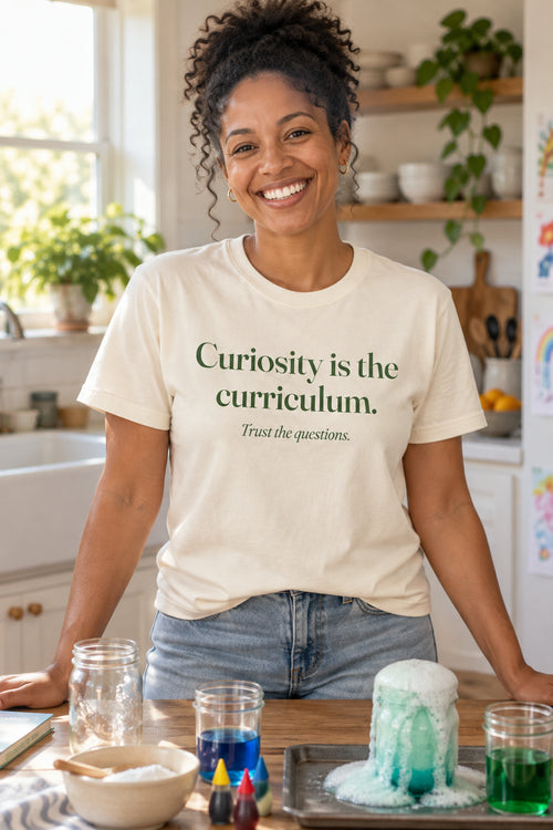 Curiosity is the curriculum. unisex organic cotton tee in Natural, front