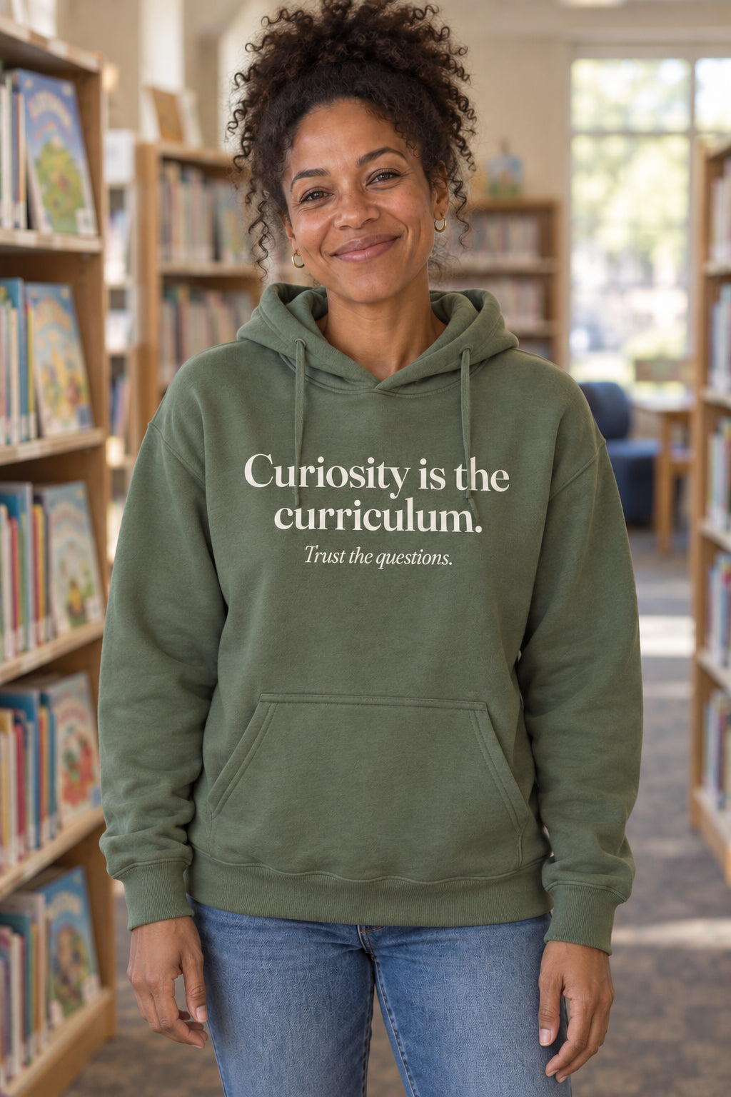 Curiosity is the curriculum. unisex organic cotton hoodie in Moss, front