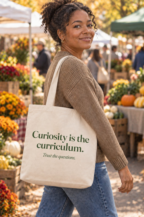 Curiosity is the curriculum. organic canvas market tote in Natural, carried on the shoulder