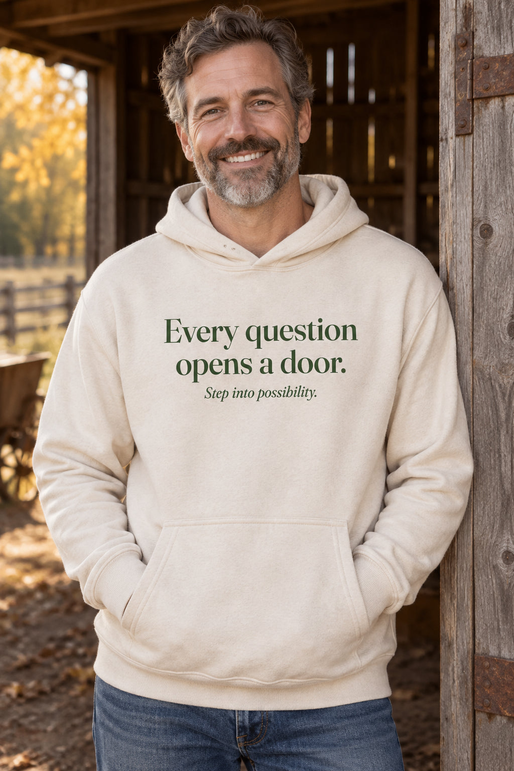 Every question opens a door. unisex organic cotton hoodie in Natural, front