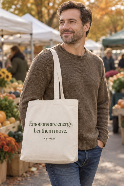 Emotions are energy. Let them move. organic canvas market tote in Natural, carried on the shoulder