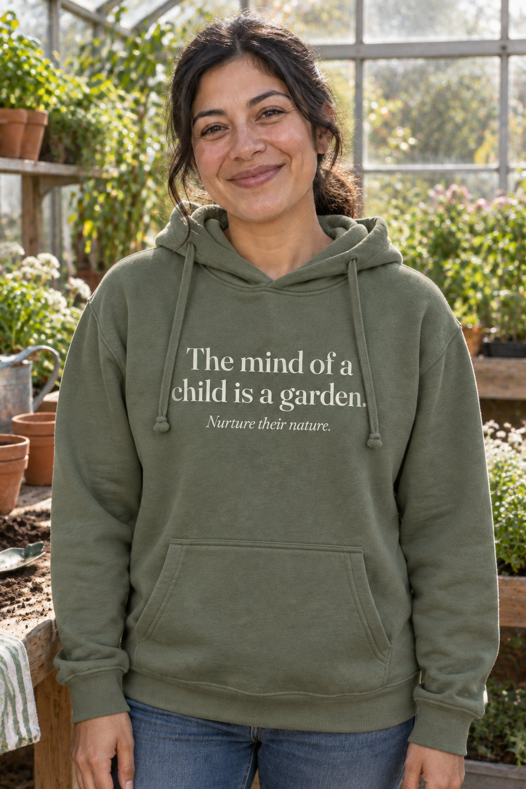 The mind of a child is a garden. unisex organic cotton hoodie in Moss, front