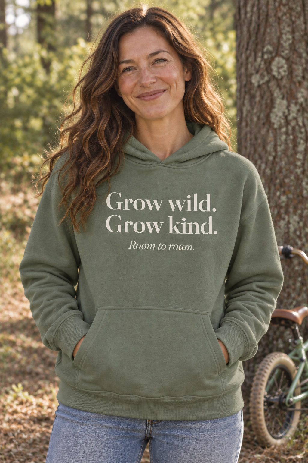 Grow wild. Grow kind. unisex organic cotton hoodie in Moss, front
