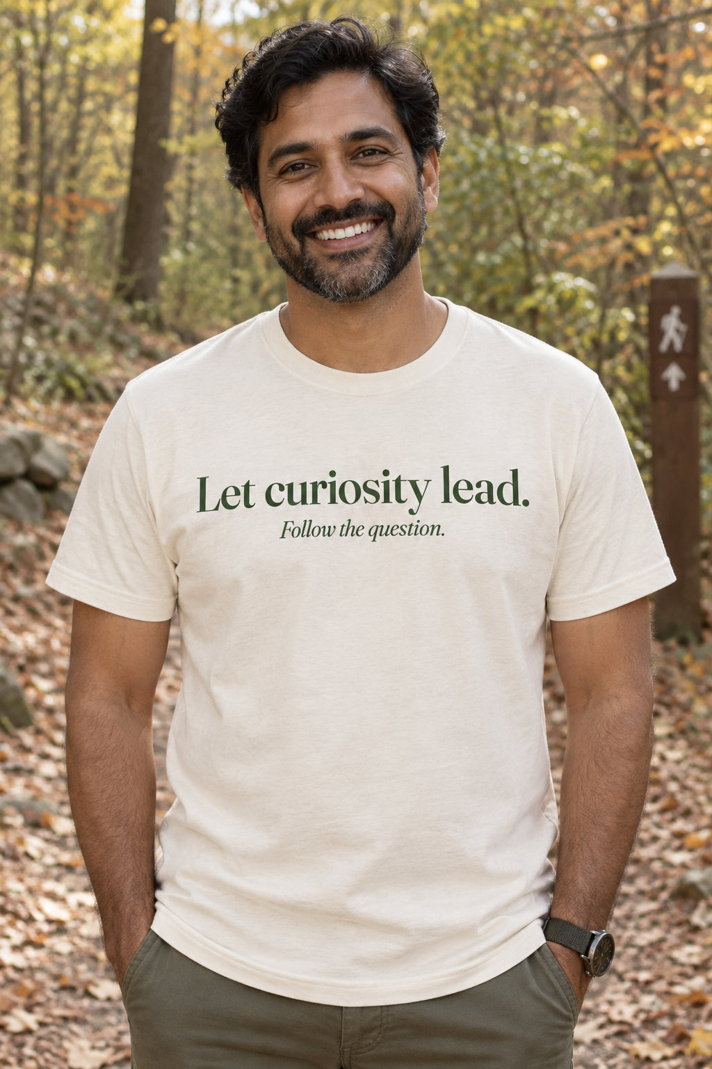 Let curiosity lead. unisex organic cotton tee in Natural, front
