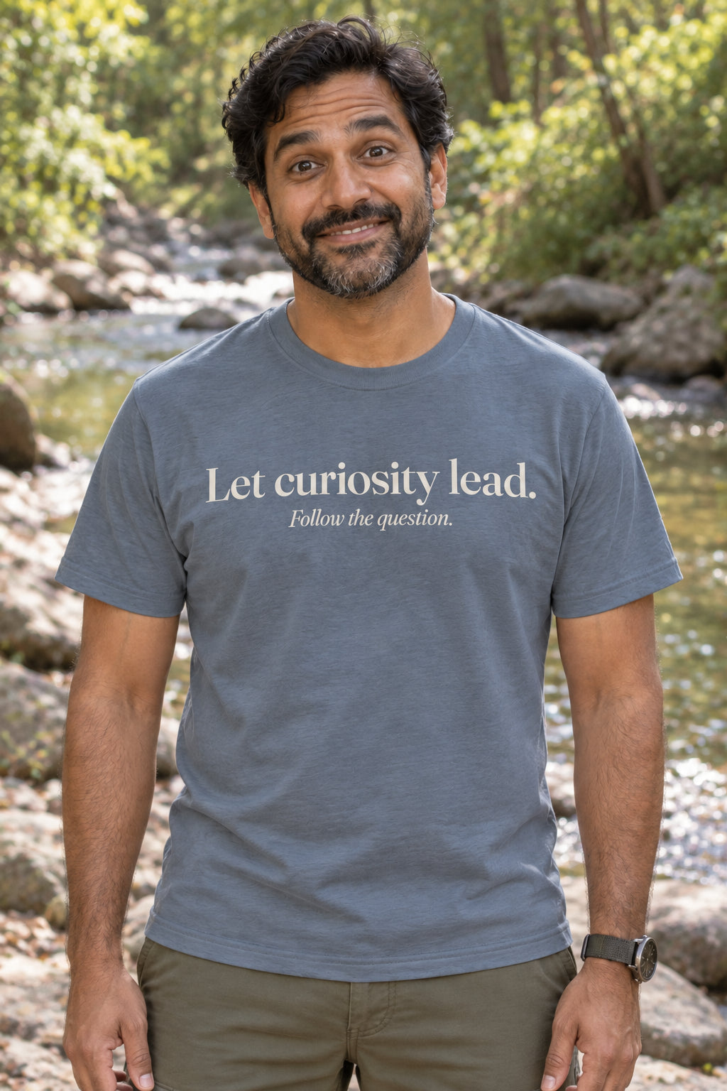 Let curiosity lead. unisex organic cotton tee in Slate, front