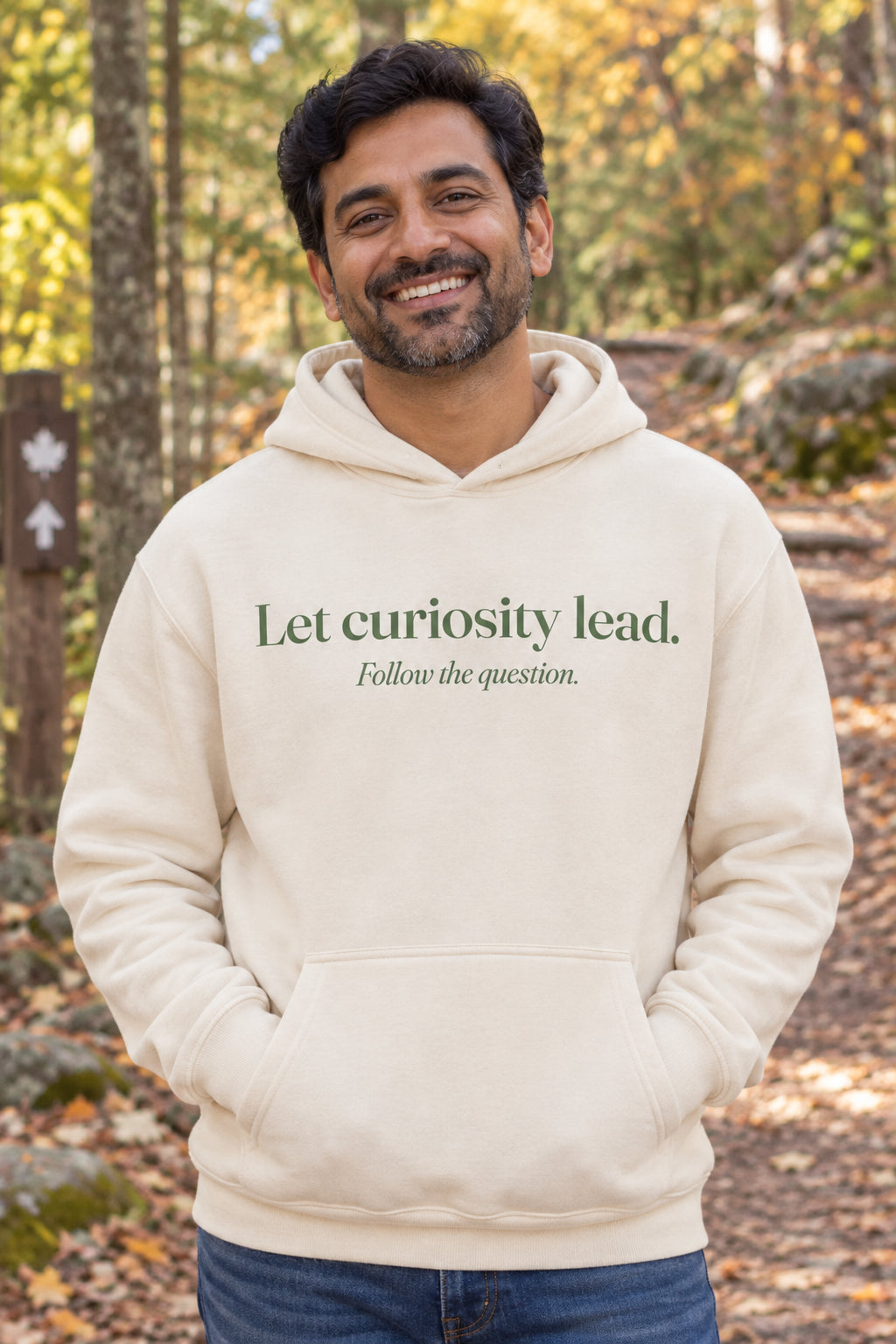 Let curiosity lead. unisex organic cotton hoodie in Natural, front