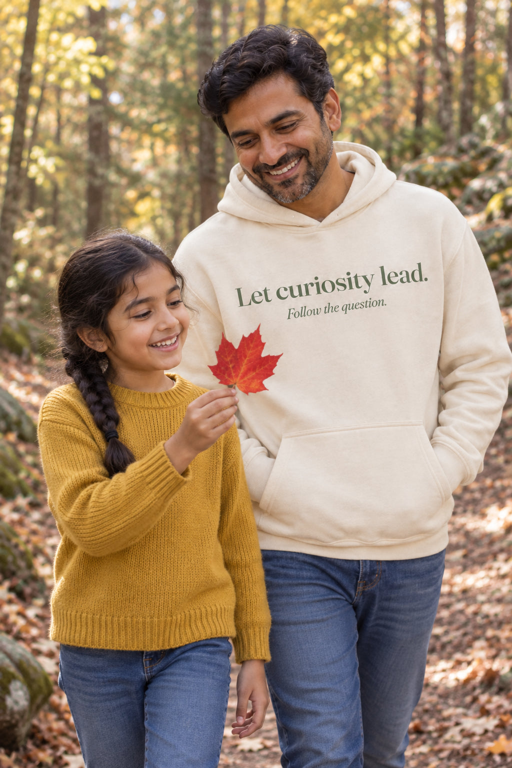 Parent wearing the Let curiosity lead. hoodie tee in Natural