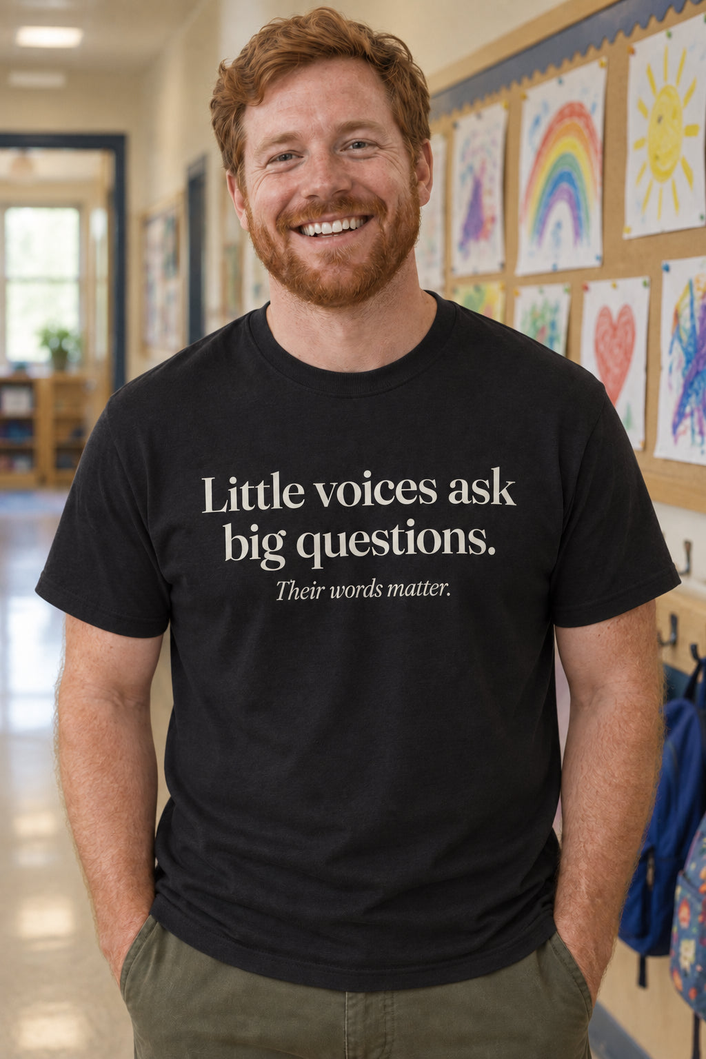 Little voices ask big questions. unisex organic cotton tee in Night, front