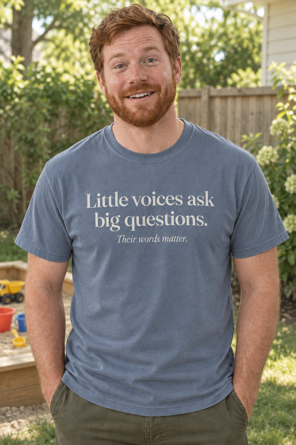 Little voices ask big questions. unisex organic cotton tee in Slate, front