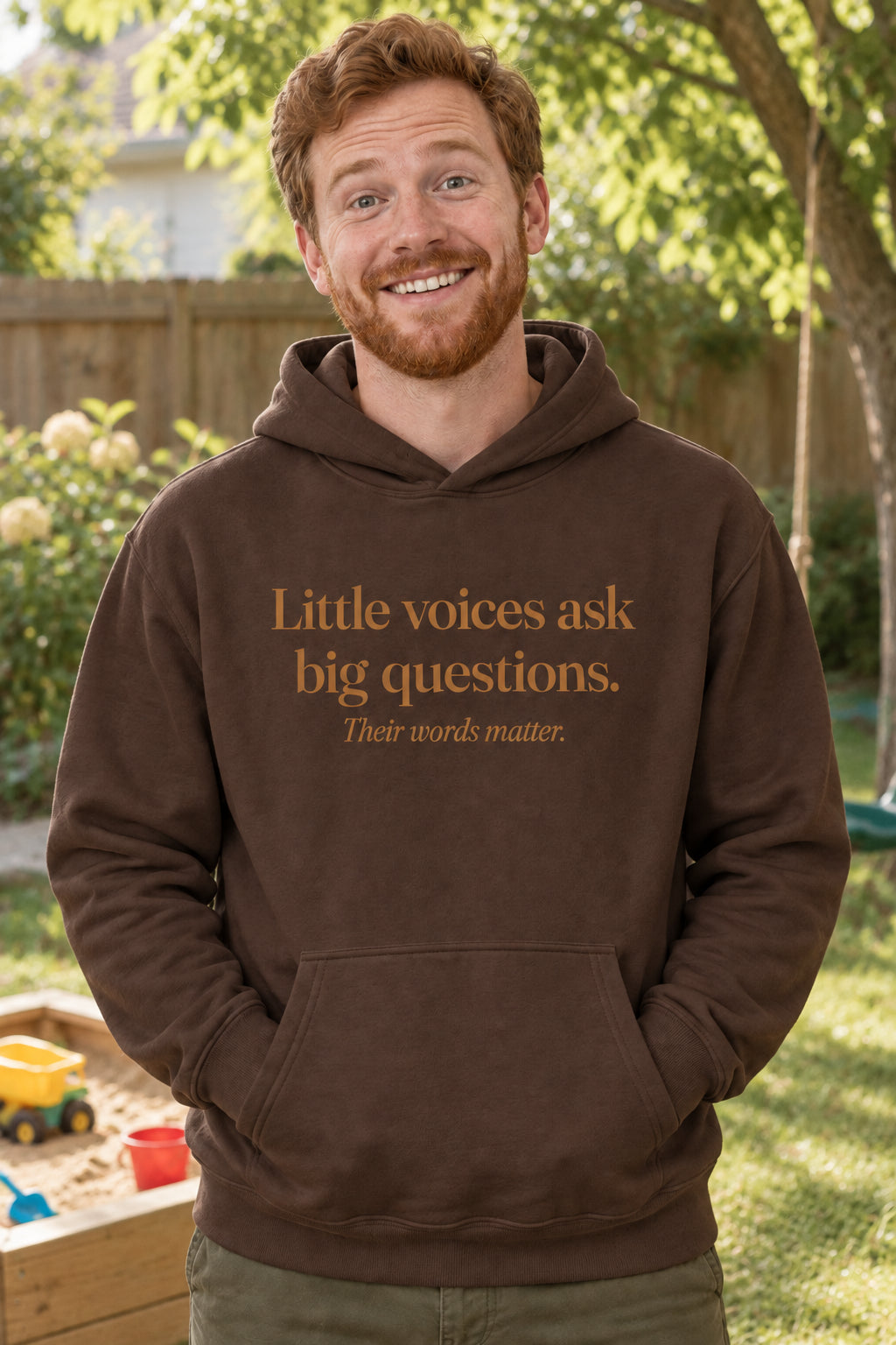 Little voices ask big questions. unisex organic cotton hoodie in Bark, front