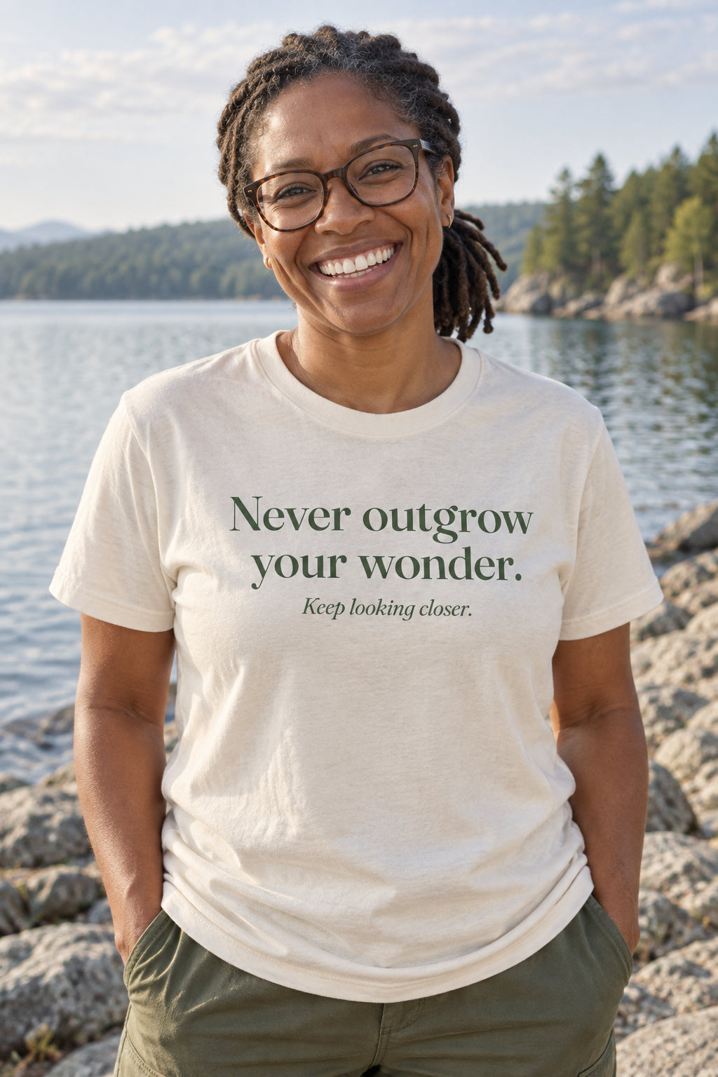 Never outgrow your wonder. unisex organic cotton tee in Natural, front