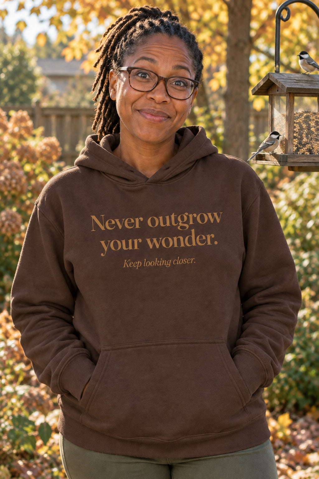 Never outgrow your wonder. unisex organic cotton hoodie in Bark, front