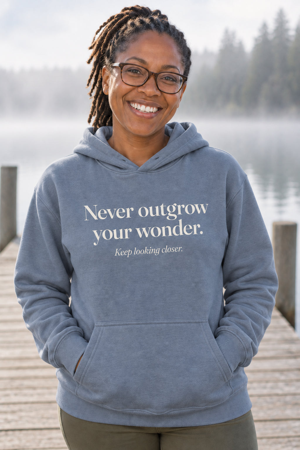Never outgrow your wonder. unisex organic cotton hoodie in Slate, front