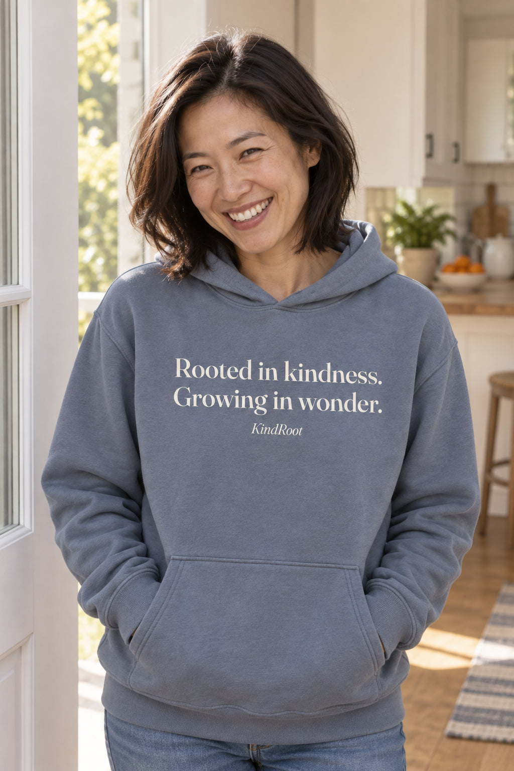 Rooted in kindness. Growing in wonder. unisex organic cotton hoodie in Slate, front