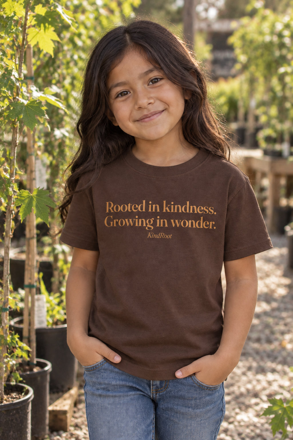 Rooted in kindness. Growing in wonder. kids organic cotton tee in Bark, front