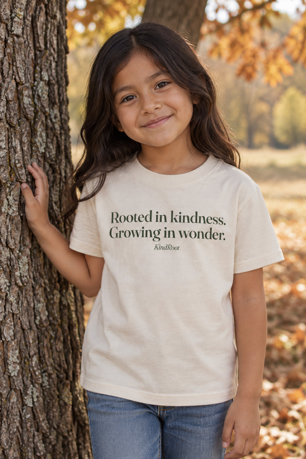 Rooted in kindness. Growing in wonder. kids organic cotton tee in Natural, front