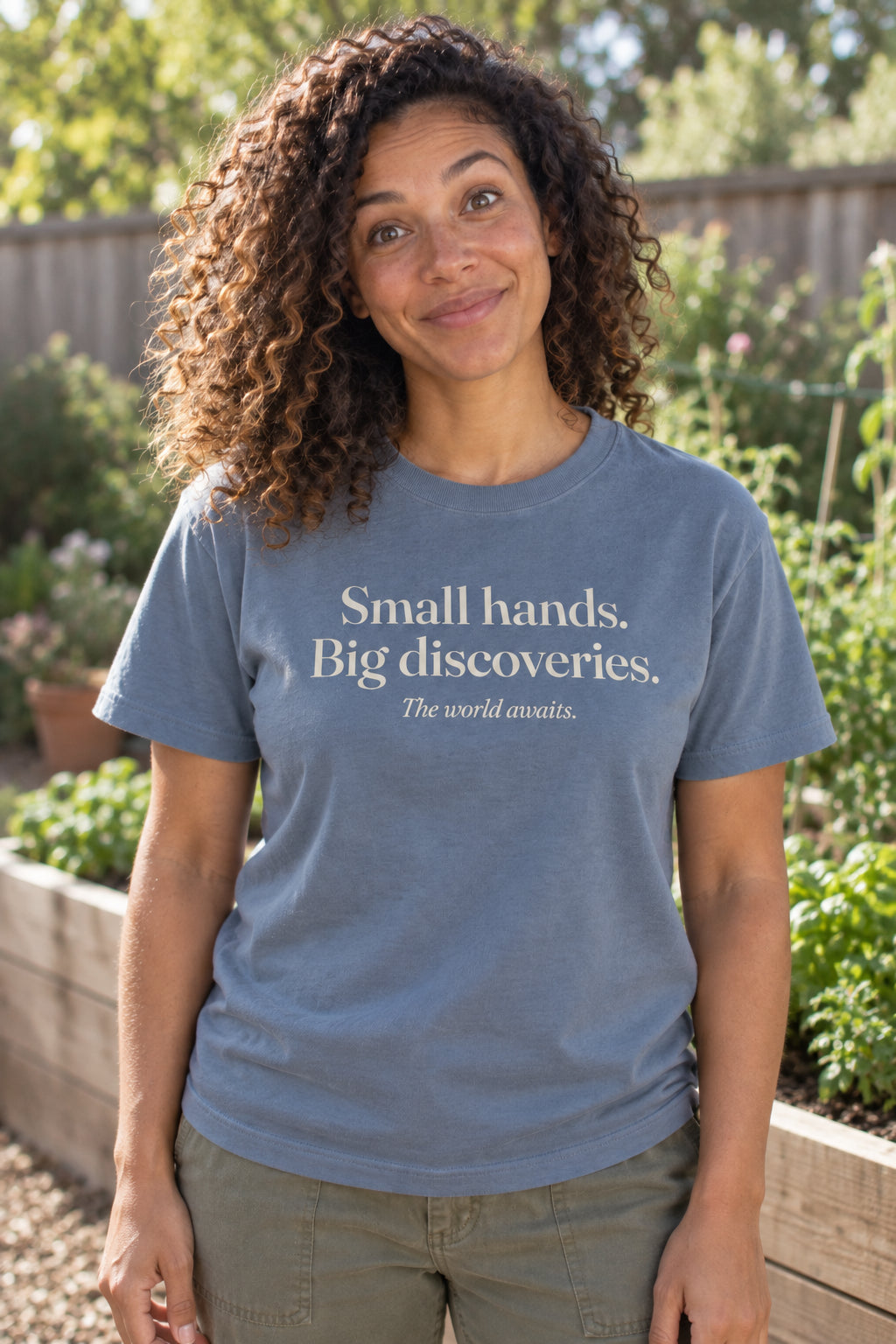 Small hands. Big discoveries. unisex organic cotton tee in Slate, front
