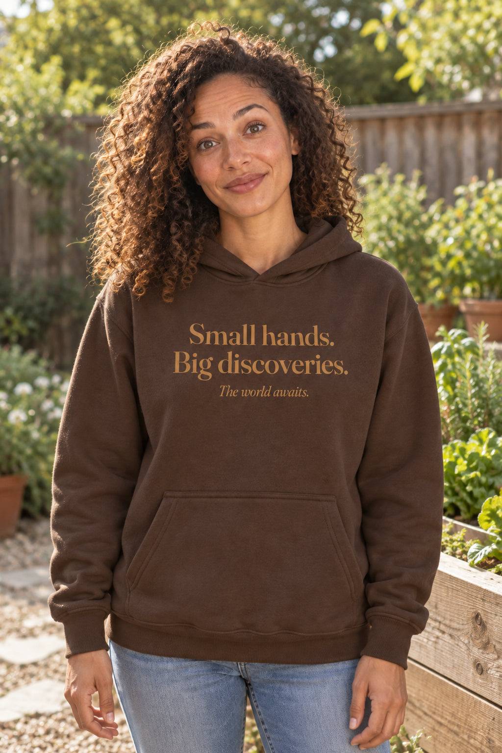 Small hands. Big discoveries. unisex organic cotton hoodie in Bark, front