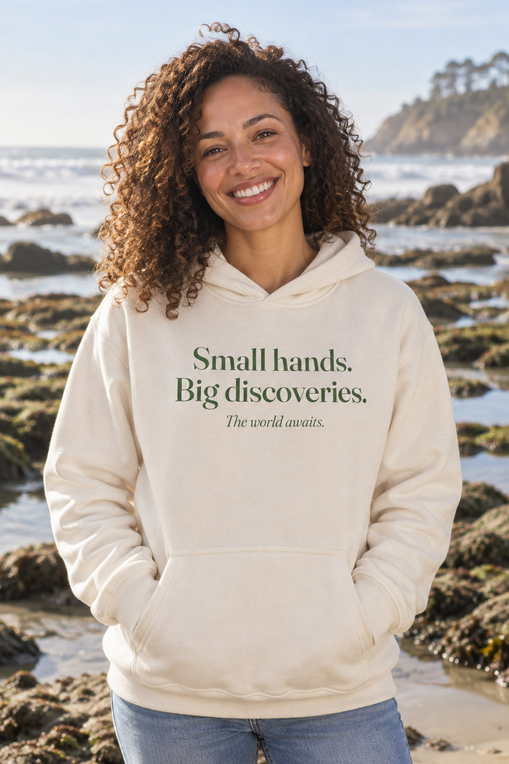 Small hands. Big discoveries. unisex organic cotton hoodie in Natural, front