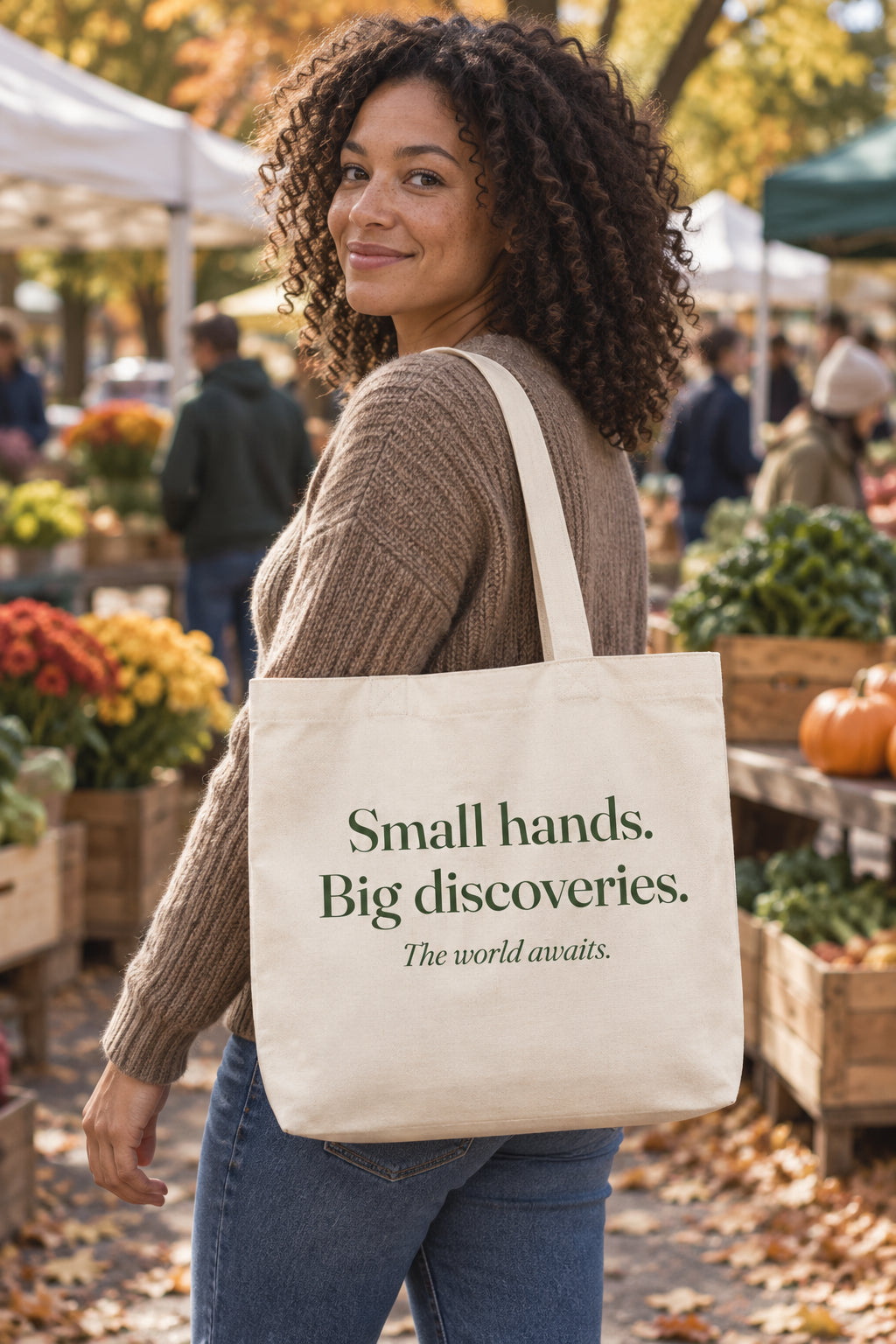 Small hands. Big discoveries. organic canvas market tote in Natural, carried on the shoulder