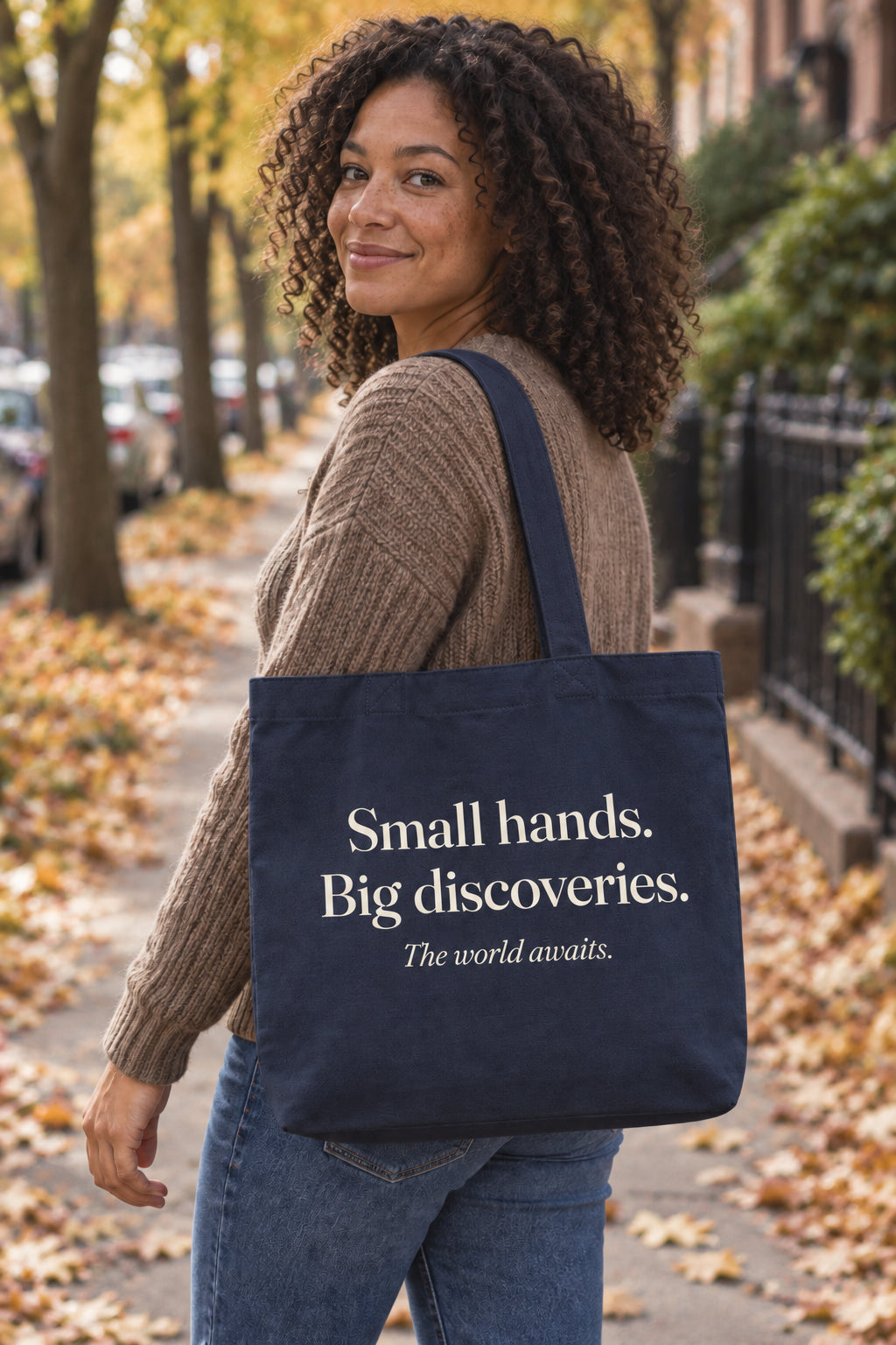 Small hands. Big discoveries. organic canvas market tote in Navy, carried on the shoulder